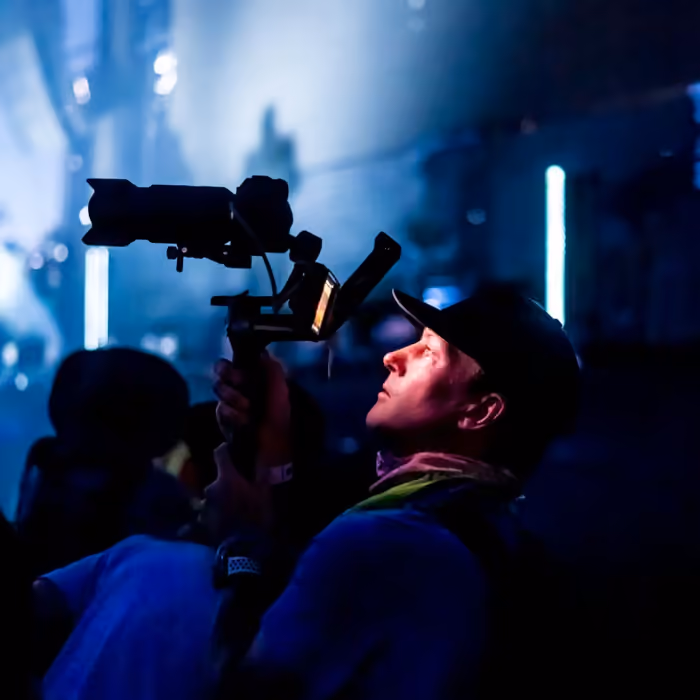 Chris Terry shooting video on a gimbal rig during a concert at Coachella